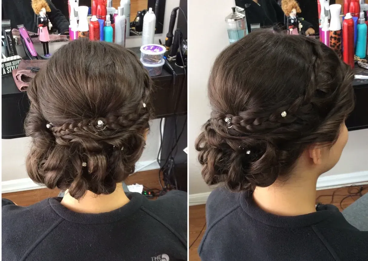 Braided updo hairstyle with floral hairpins, shown from back and side in a salon chair